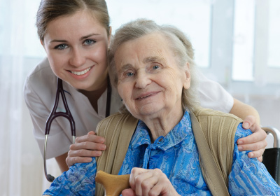 Elderly woman and her caregiver